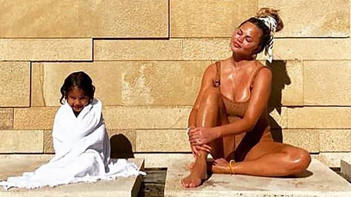 Chrissy Teigen Pairs a Crochet Swimsuit With a Gorgeous Head Scarf
