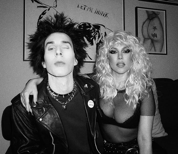 Travis Barker and Kourtney Kardashian dress as Sid and Nancy for Halloween